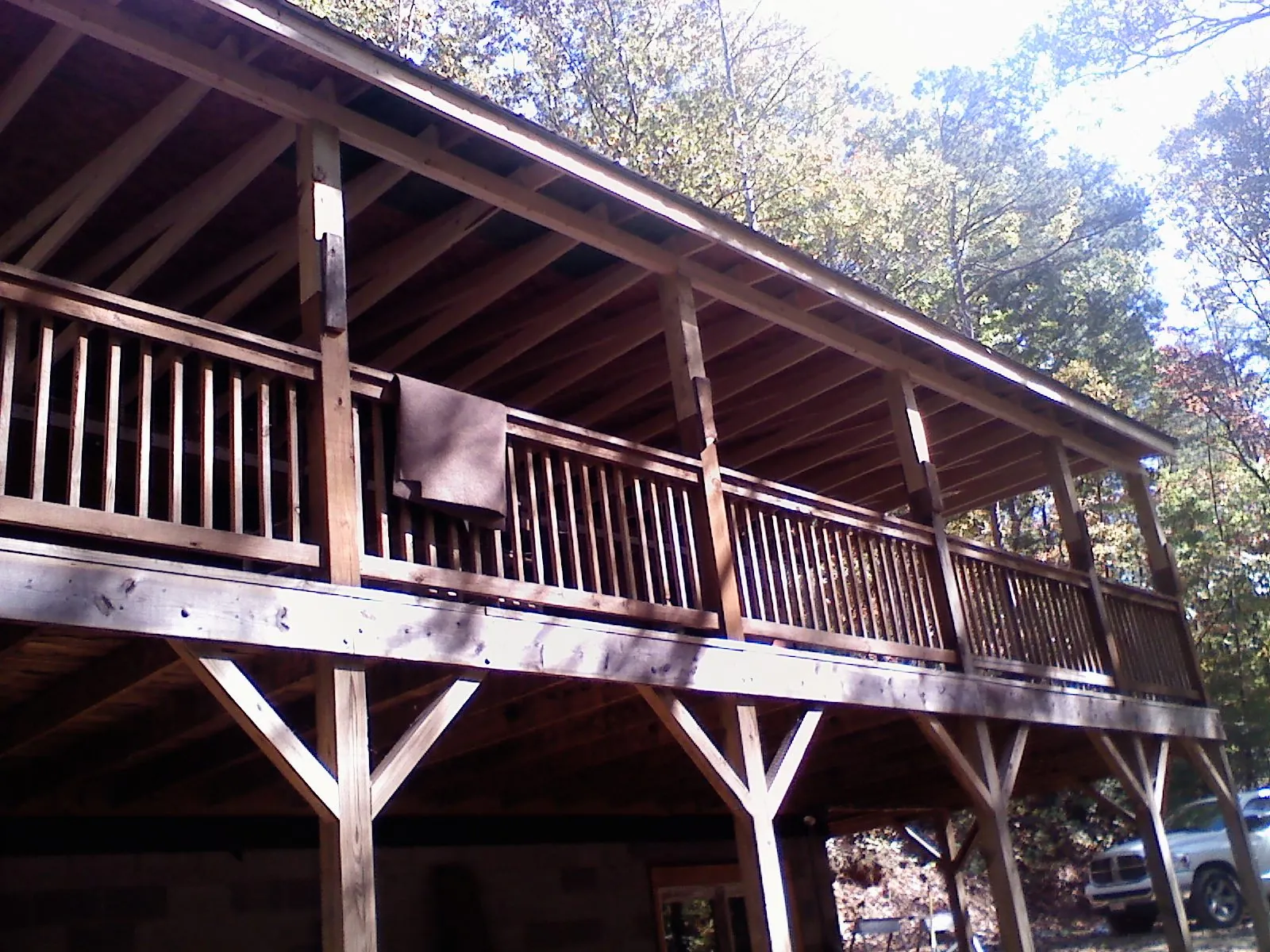 Timber framing under a new elevated porch and deck — Roof Leak Repair in College Station by Roofing Brothers